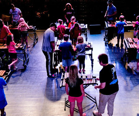 Kids and instructors on marimbas